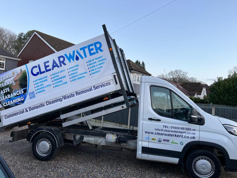 Clearwater Kent cleaning services van displaying various cleaning and waste removal services, parked in a residential area.